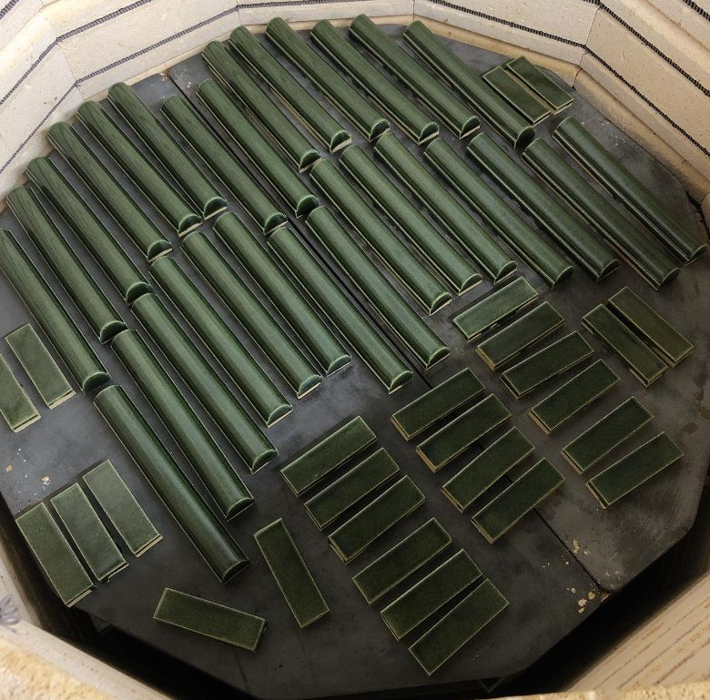 Green glazed tile cooling in an open kiln